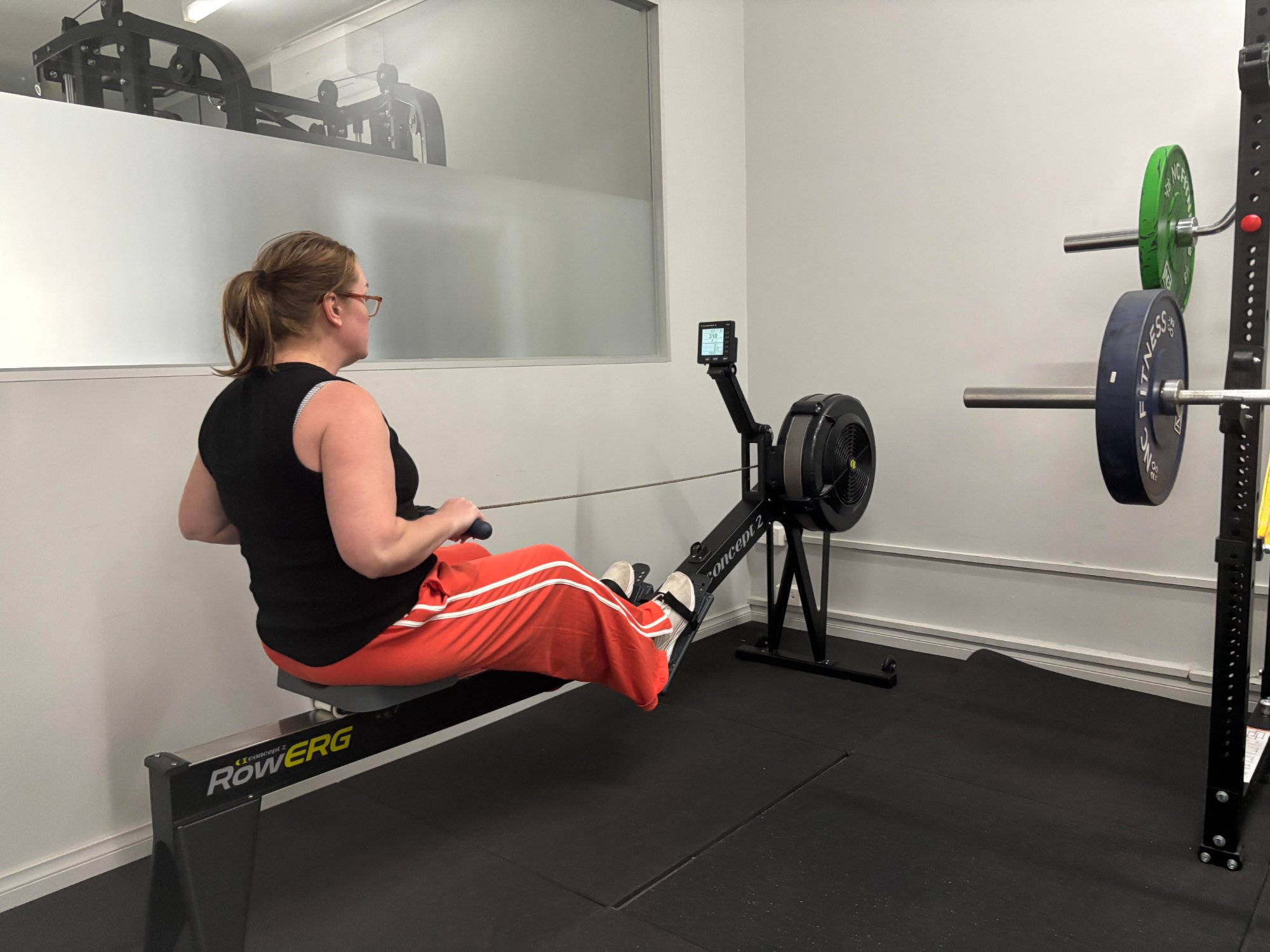 Veteran using rowing machine during DVA-funded exercise physiology session at Black Site Fitness